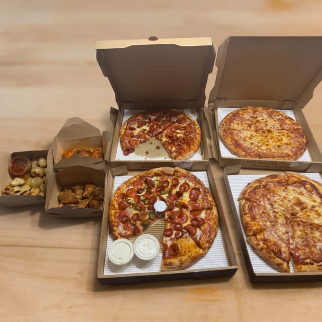 Ultimate Party Pack - Four Large Pizzas with Up to 3 Toppings Each, (20 Pieces) Wings & (24 Pieces) Garlic Knots.
